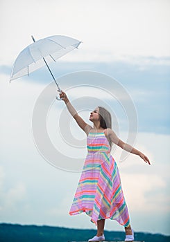 I believe i can fly. Touch sky. Girl with light umbrella. Fairy tale character. Happy childhood. Feeling light. Anti