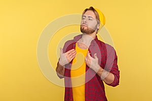 I am best! Proud arrogant hipster bearded guy in beanie hat and checkered shirt pointing himself, standing smug photo