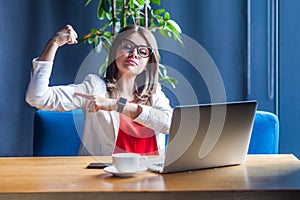 I can do anything. Portrait of proud beautiful stylish young woman in glasses sitting, looking at her laptop screen on video call