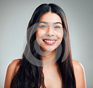 I can switch things up, anytime and any day. Studio shot of a beautiful young woman with half curled hair and half