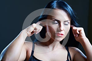 I Can't Hear You. Young woman covering her ears