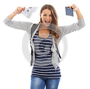 I cant wait to travel. A gorgeous young woman celebrating buying her plane tickets while isolated on a white background.