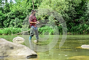 I Choose my passion. man catching fish. mature man fly fishing. fisherman show fishing technique use rod. sport activity