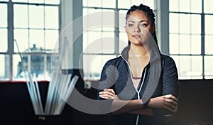 I am in control of my body. Portrait of a young woman in a gym.