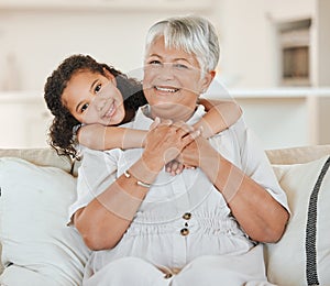 I couldnt wait to be a grandma. a mature woman bonding with her granddaughter on a sofa at home.