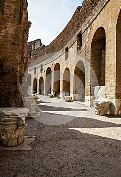 I curved corridor inside the ruins of the Roman colosseum with sunlight