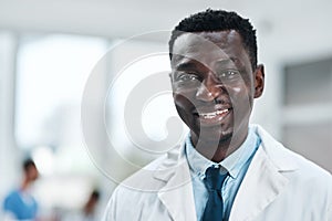 I dedicate my life to saving yours. Portrait of a mature doctor standing in a hospital.