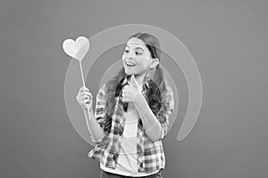 I definitely like this. Vote for love. Girl little child hold heart symbol on stick. Like and support. Valentines day
