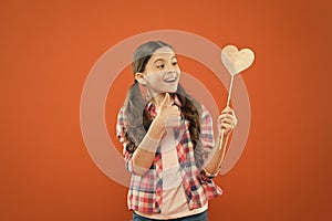 I definitely like this. Vote for love. Girl little child hold heart symbol on stick. Like and support. Valentines day