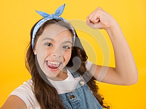 I did it. Happy little girl flex biceps on yellow background. Girls power. Girls rule the world. Future is female