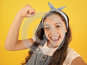 I did it. Happy little girl flex biceps on yellow background. Girls power. Girls rule the world. Future is female