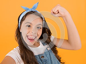 I did it. Happy little girl flex biceps on yellow background. Girls power. Girls rule the world. Future is female