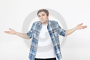 I don`t know. Young man isolated on grey background. Copy space. Mock up. No Choice. Unsure student guy.