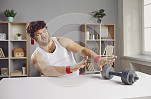 Funny lazy chubby man pushing away dumbbells unwilling to start sports workouts at gym photo