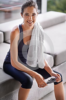 I really enjoyed my workout today. an attractive young woman relaxing after a workout.