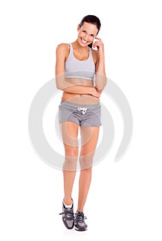 I feel absolutely amazing. Portrait of an attractive and sporty young woman against a white background.