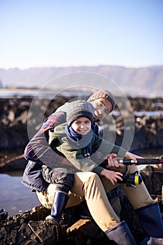 I have the best dad. Portrait of a loving father and son fishing by the sea.