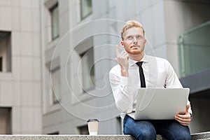 I have idea! Handsome ginger businessman with beard looking up and finger up.