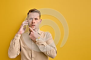 I have idea. Man sharing ideas with business partner while talking on phone