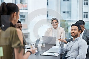 I have a question, just to be clear...a group of businesspeople having a meeting in an office.