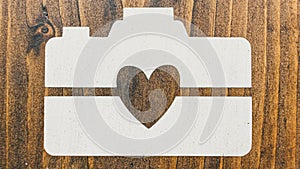 I Heart Camera on dark wood background texture