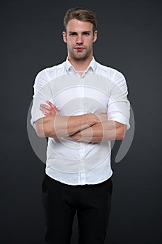 I am here to help you. Man shop consultant looks confident and hospitable. Man calm face posing confidently with folded