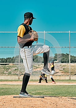 I hope you know how to swing. Shot of a young baseball player getting ready to pitch the ball during a game outdoors.