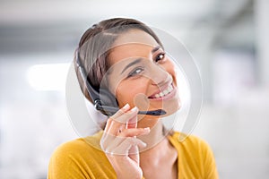 I just made another sale. an attractive young customer service representative wearing a headset.