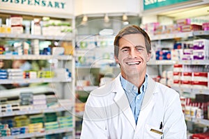 I keep my customers healthy. Cropped portrait of a handsome young male pharmacist standing in the pharmacy.