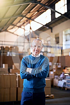 I know where every box needs to go. Portrait of a mature man standing on the floor of a warehouse.