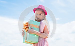 I like presents. beautiful teen girl with gift. kid fashion style. female natural beauty. happy childhood. cute child on