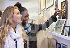 I like this work.... Two art students admiring some art in a gallery.