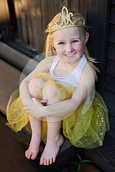 I live in the land of make believe. Full length portrait of an adorable little girl playing make believe outdoors.