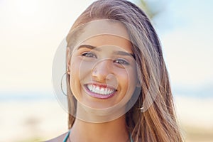 I live for summer. Portrait of an attractive young woman standing outside on a sunny day.