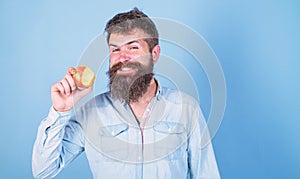 I love apples Man handsome hipster with long beard eating apple. Hipster hungry bites enjoy ripe apple. Fruit healthy
