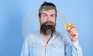 I love apples Man handsome hipster with long beard eating apple. Hipster hungry bites enjoy ripe apple. Man diet