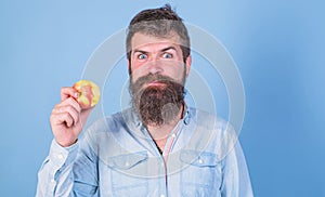 I love apples Man handsome hipster with long beard eating apple. Hipster hungry bites enjoy ripe apple. Man diet