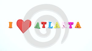 I love Atlanta. Text from colorful wooden letters and a beating paper red heart.