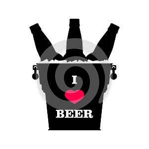 `I love beer` slogan on metal beer bucket full of ice with beer bottles and red heart. Black silhouette.