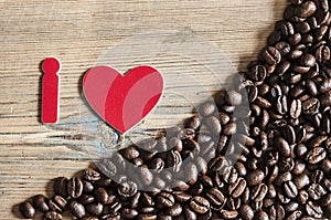 i love coffee, coffee beans used to spell on old wooden background