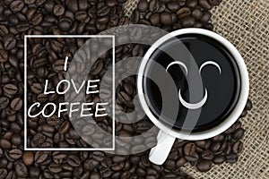 I love coffee text in coffee cup on coffee beans background