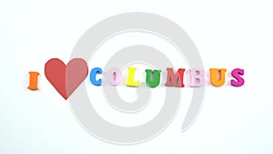 I love Columbus. Text from colorful wooden letters and a beating paper red heart.