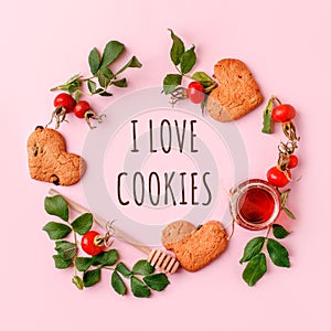 I love cookies, Ingredinets for winter fall autumn seasonal beverage tea party - fresh rose hip berries, honey, apple and heart-