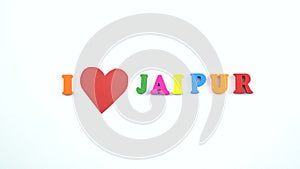 I love Jaipur. Text from colorful wooden letters and a beating paper red heart.
