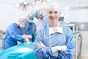 I love this job. Portrait of a happy female surgeon smiling in an operating theatre - Copyspace.