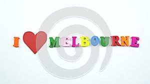 I love Melbourne. Text from colorful wooden letters and a beating paper red heart.