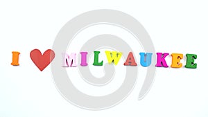 I love Milwaukee. Text from colorful wooden letters and a beating paper red heart.