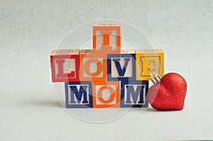 I love mom spelled with colorful alphabet blocks