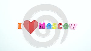 I love Moscow. Text from colorful wooden letters and a beating paper red heart.