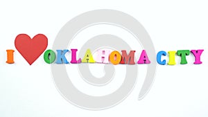 I love Oklahoma City. Text from colorful wooden letters and a beating paper red heart.